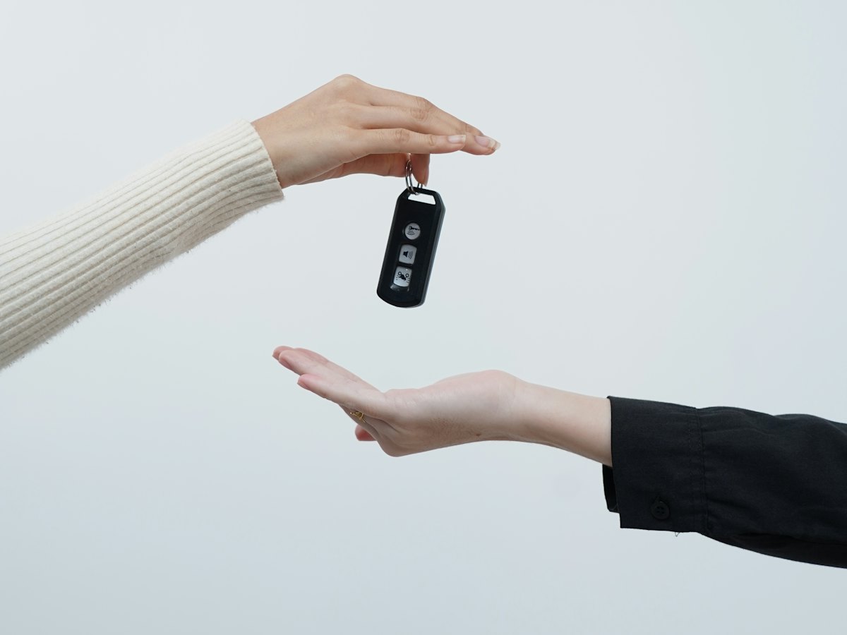 Car keys being handed over